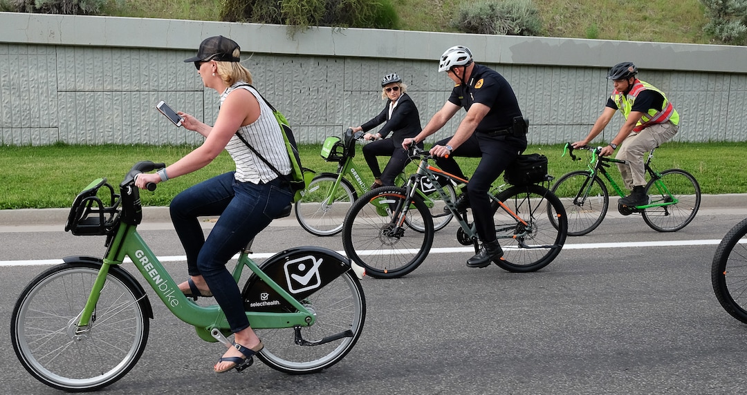 (Francisco Kjolseth  |  The Salt Lake Tribune)  Salt Lake City Mayor Jackie Biskupski, center back,  is joined by Police Chief Mike Brown, members of the public and city employees on Thursday, May 16, 2019, as part of the annual MayorÕs Bike to Work Day. This yearÕs ride began at the Northwest Recreation Center and ran primarily along the Jordan River Trail in an effort to show off the investments the city and others have made to the trail.