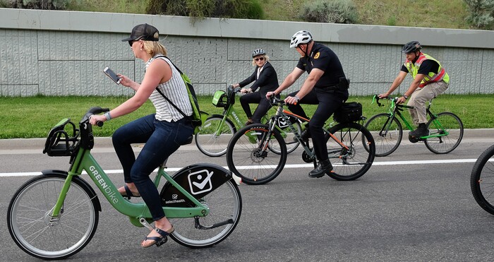 (Francisco Kjolseth | The Salt Lake Tribune) Salt Lake City Mayor Jackie Biskupski, center back, is joined by Police Chief Mike Brown, members of the public and city employees on Thursday, May 16, 2019, as part of the annual MayorÕs Bike to Work Day. This yearÕs ride began at the Northwest Recreation Center and ran primarily along the Jordan River Trail in an effort to show off the investments the city and others have made to the trail.