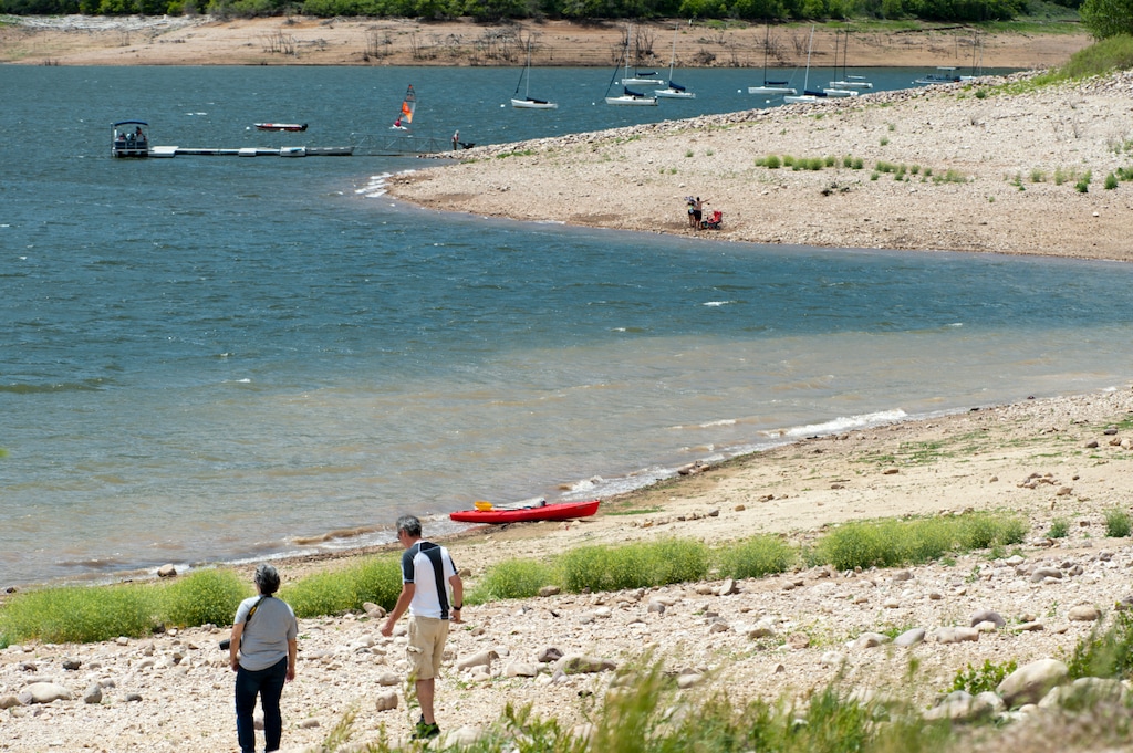(Ed Kosmicki | Special to The Tribune) The shoreline of the Jordanelle Reservoir is a lot lower than it used to be after several years of drought. Beach goers have to walk much further from the parking areas to the waterline, June 9, 2021.