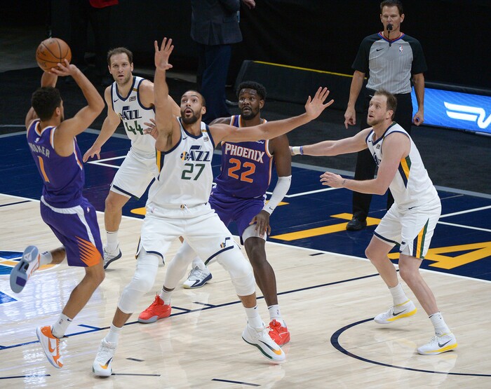 (Leah Hogsten | The Salt Lake Tribune) Phoenix Suns guard Devin Booker (1) drives to the net to Utah Jazz center Rudy Gobert (27) as the Jazz crack open their 2020-21 preseason with their second game against the Phoenix Suns, Dec. 14, 2020.