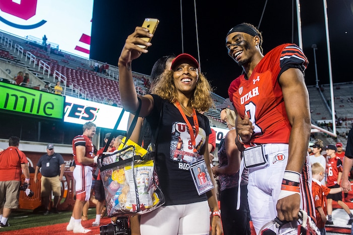 (Chris Detrick | The Salt Lake Tribune) Utah Utes wide receiver Darren Carrington (9) takes a selfie with his sister Diara Carrington after the game at Rice-Eccles Stadium Thursday, August 31, 2017. Utah Utes defeated North Dakota Fighting Hawks 37-16.