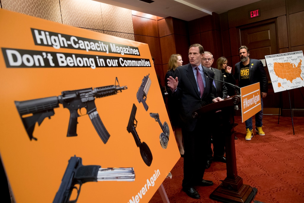 (Andrew Harnik | AP) Sen. Richard Blumenthal, D-Conn., center, accompanied by Sen. Bob Menendez, D-N.J., third from right, speaks at a news conference on an proposed amendment to ban high capacity magazines in guns, on Capitol Hill, Tuesday, Feb. 12, 2019, in Washington.