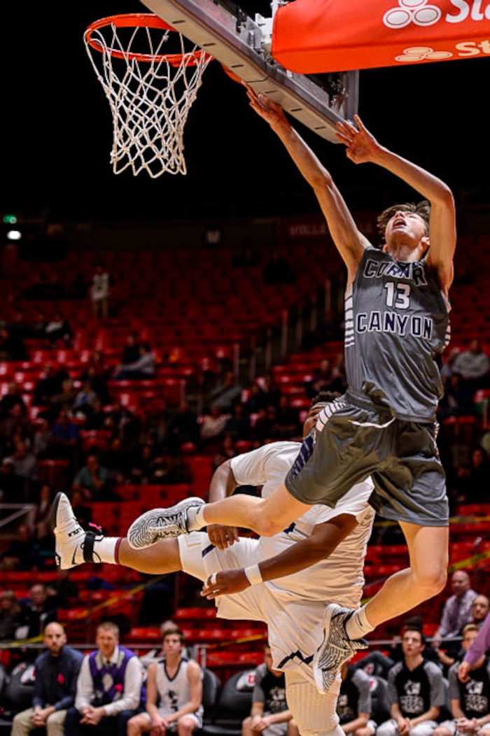 (Trent Nelson | The Salt Lake Tribune)  Box Elder vs. Corner Canyon, 5A State high school basketball tournament at the Huntsman Center in Salt Lake City, Wednesday Feb. 28, 2018. Corner Canyon's Hayden Welling (13) shoots ahead of Box Elder's Tyson Madson (15).