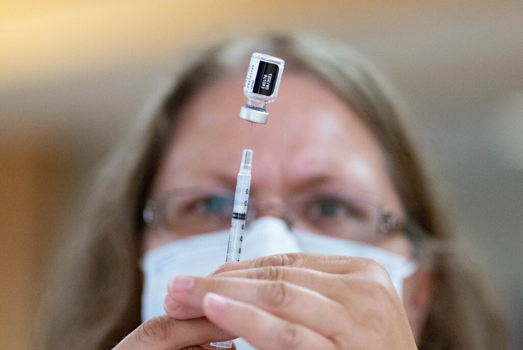 (Francisco Kjolseth | The Salt Lake Tribune) Registered nurse Clarece Glanville prepares the Pfizer vaccine as the Davis County Health Department holds a walk-in COVID-19 vaccination clinic at the South Davis Senior Activity Center on Wednesday, July 21, 2021. Utah hospitals saw the continuation of July's surge of COVID-19 cases and hospitalizations over the Pioneer Day weekend.
