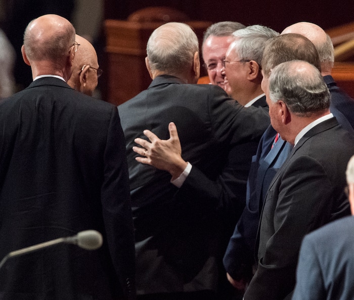 (Rick Egan  |  The Salt Lake Tribune)         President Russell M. Nelson hugs new Apostle, Gerrit W. Gong, after the Saturday morning session of the188th Annual General Conference in Salt Lake City,  Saturday, March 31, 2018.