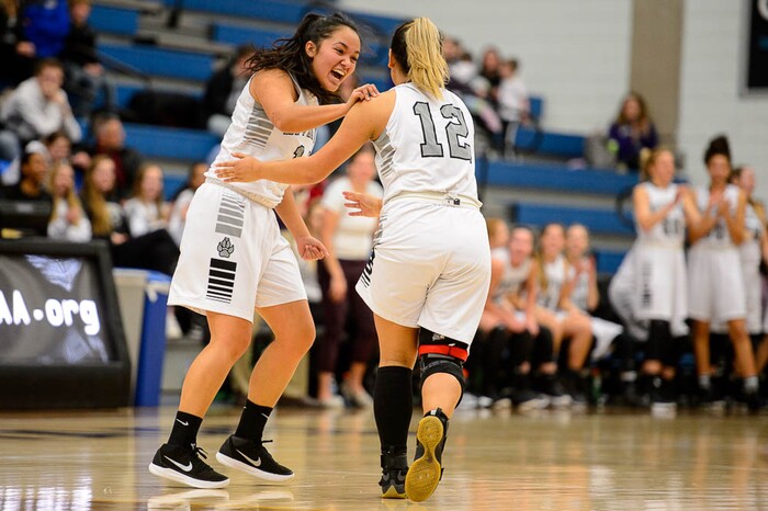 (Trent Nelson | The Salt Lake Tribune)  Riverton's Kaitlin Burgess (14) and Riverton's Jaydeene Burgess (12) celebrate a double-digit lead as Riverton faces American Fork in the 6A High School Girls' Basketball Tournament at SLCC in Taylorsville, Tuesday Feb. 20, 2018.