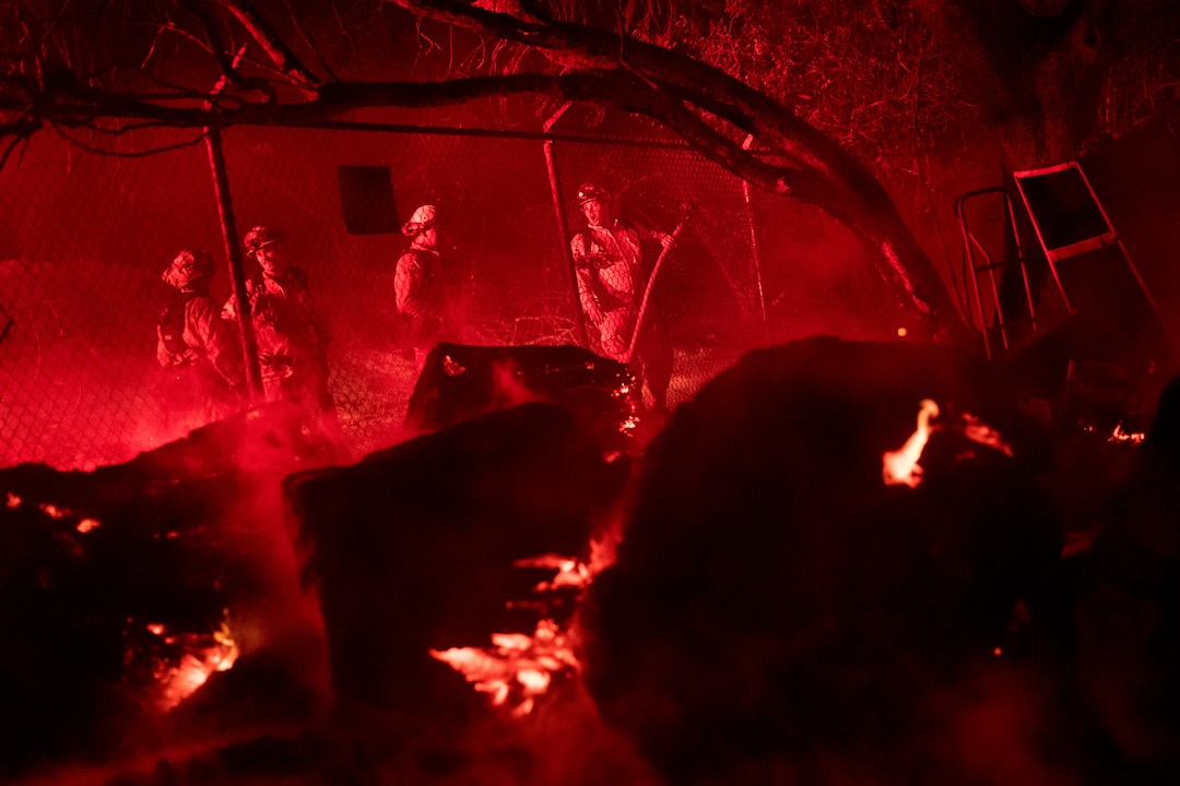 Firefighters battle a wildfire in Ojai, Calif., on Thursday, Dec. 7, 2017. (AP Photo/Noah Berger)