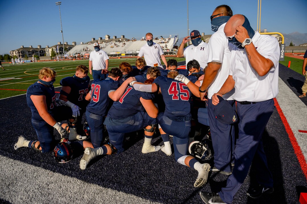 (Trent Nelson  |  The Salt Lake Tribune) Herriman players huddle up before facing Davis, high school football, in Herriman on Thursday, Aug. 13, 2020.