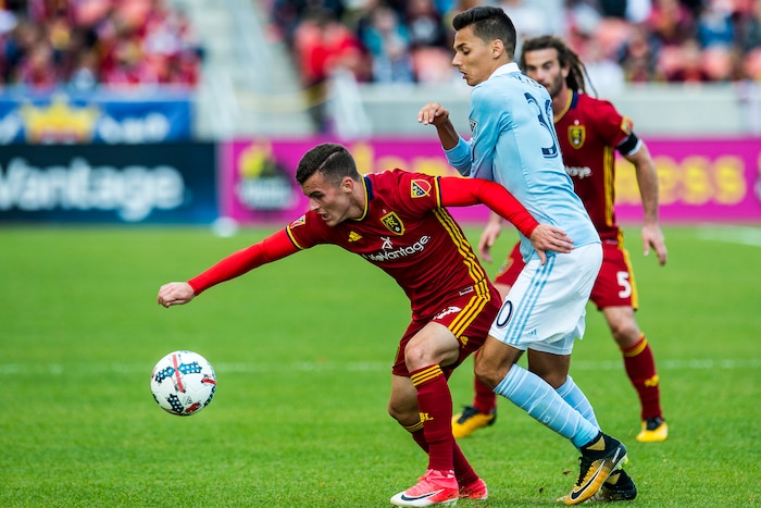 (Chris Detrick  |  The Salt Lake Tribune)  Real Salt Lake forward Brooks Lennon (27) and Sporting Kansas City forward Daniel Salloi (30) go for the ball during the game at Rio Tinto Stadium Sunday, October 22, 2017.  
