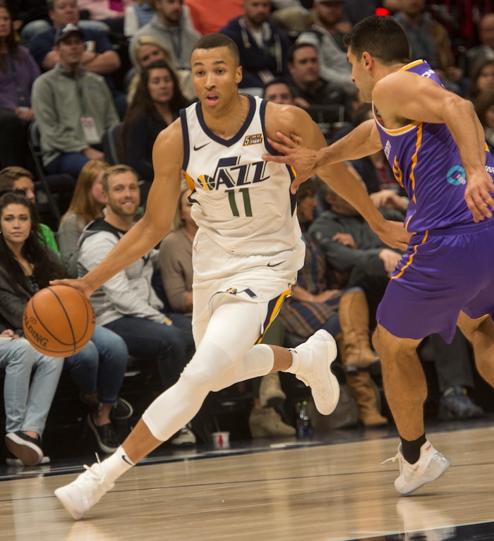 (Rick Egan  |  The Salt Lake Tribune) Utah Jazz guard Dante Exum (11)
takes the ball to the hoop, as Sydney Kings guard Kevin Lisch (11) defends, in preseason basketball  action, Utah Jazz vs. Sydney Kings, in Salt Lake City, Sunday, October 2, 2017.


