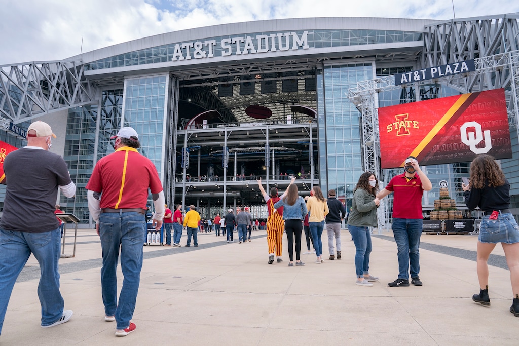 (Jeffrey McWhorter | AP) Fans enter AT&T Stadium before an NCAA college football game between Iowa State and Oklahoma for the Big 12 Conference championship, Saturday, Dec. 19, 2020, in Arlington, Texas. BYU could have a hand in determining this year's championship game matchup.
