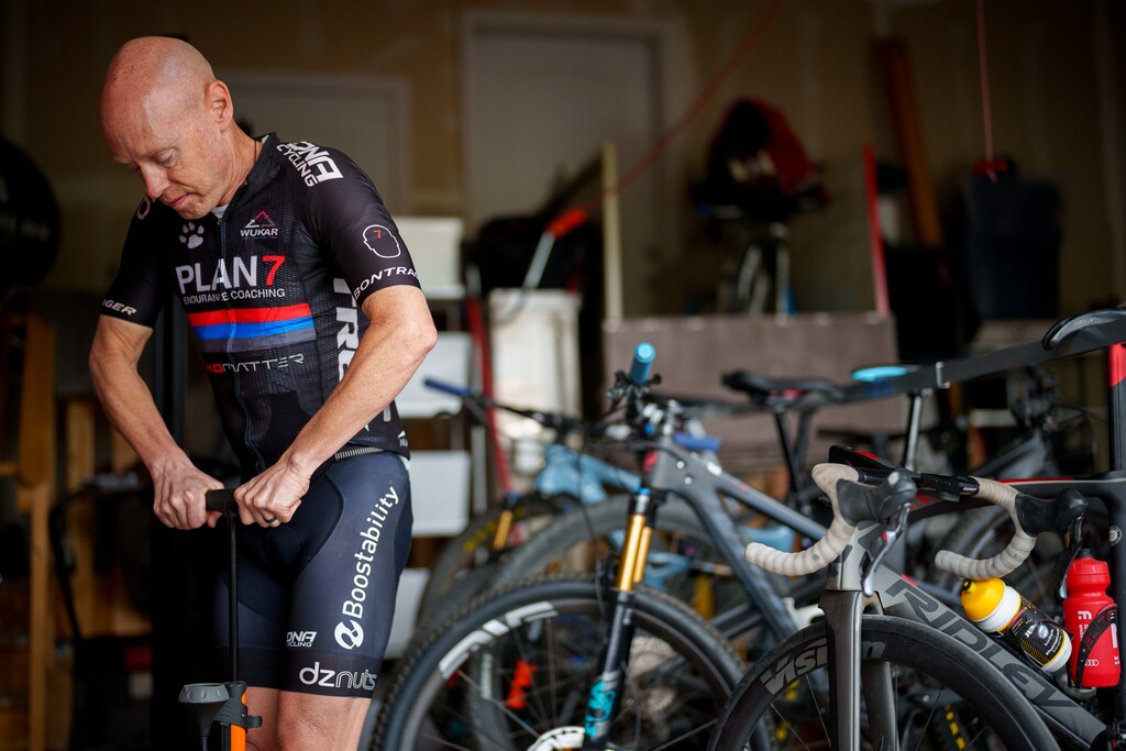 (Trent Nelson  |  The Salt Lake Tribune) Triathlete Kyle Brown gets ready for a bike ride at his home in Fruit Heights on Tuesday, April 26, 2022.