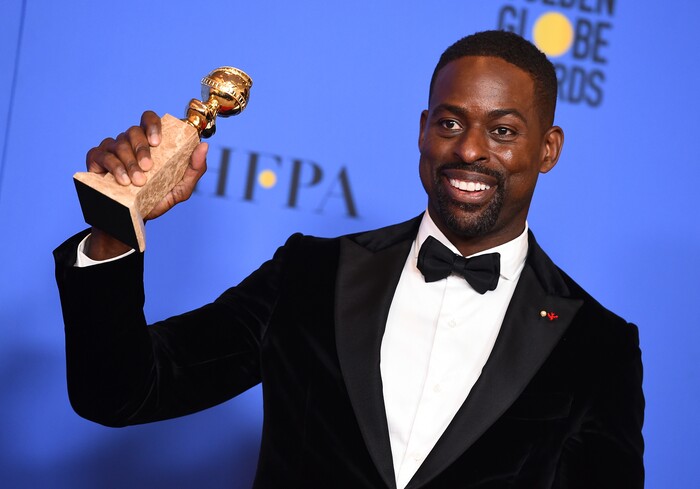 Sterling K. Brown poses in the press room with the award for best performance by an actor in a television series - drama for "This Is Us" at the 75th annual Golden Globe Awards at the Beverly Hilton Hotel on Sunday, Jan. 7, 2018, in Beverly Hills, Calif. (Photo by Jordan Strauss/Invision/AP)