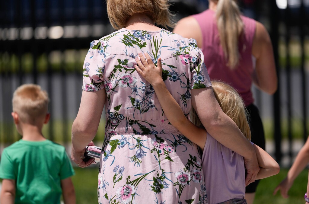 (Francisco Kjolseth | The Salt Lake Tribune) Parents embrace their children at students from at a Utah school.