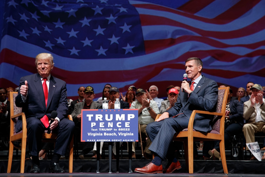 (Evan Vucci | AP photo)
Then-presidential candidate Donald Trump gives a thumbs up as he speaks with retired Lt. Gen. Michael Flynn during a town hall, Tuesday, Sept. 6, 2016, in Virginia Beach, Va. President Donald Trump has pardoned Michael Flynn, taking direct aim in the final days of his administration at a Russia investigation that he has long insisted was motivated by political bias. Trump announced the pardon on Wednesday, Nov. 25, 2020 calling it his “Great Honor.”