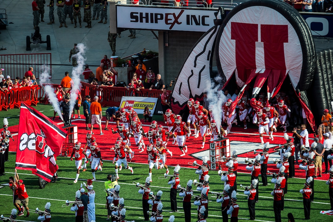 (Chris Detrick  |  The Salt Lake Tribune)  Utah Utes run onto the field before the game at Rice-Eccles Stadium Thursday, August 31, 2017. Utah Utes are leading North Dakota Fighting Hawks 17-9 at halftime. 