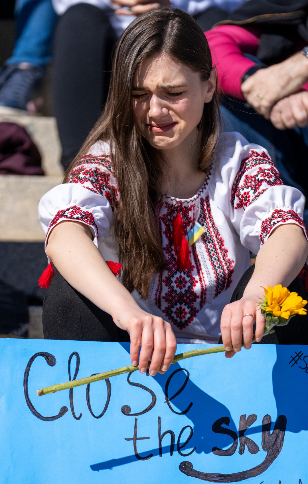 (Rick Egan | The Salt Lake Tribune) Albina Rasmussen listens to speakers as she gathers on the Capitol steps for a protest against Russia's invasion of Ukraine, organized by the Utah Ukrainian association, on Saturday, March 12, 2022.