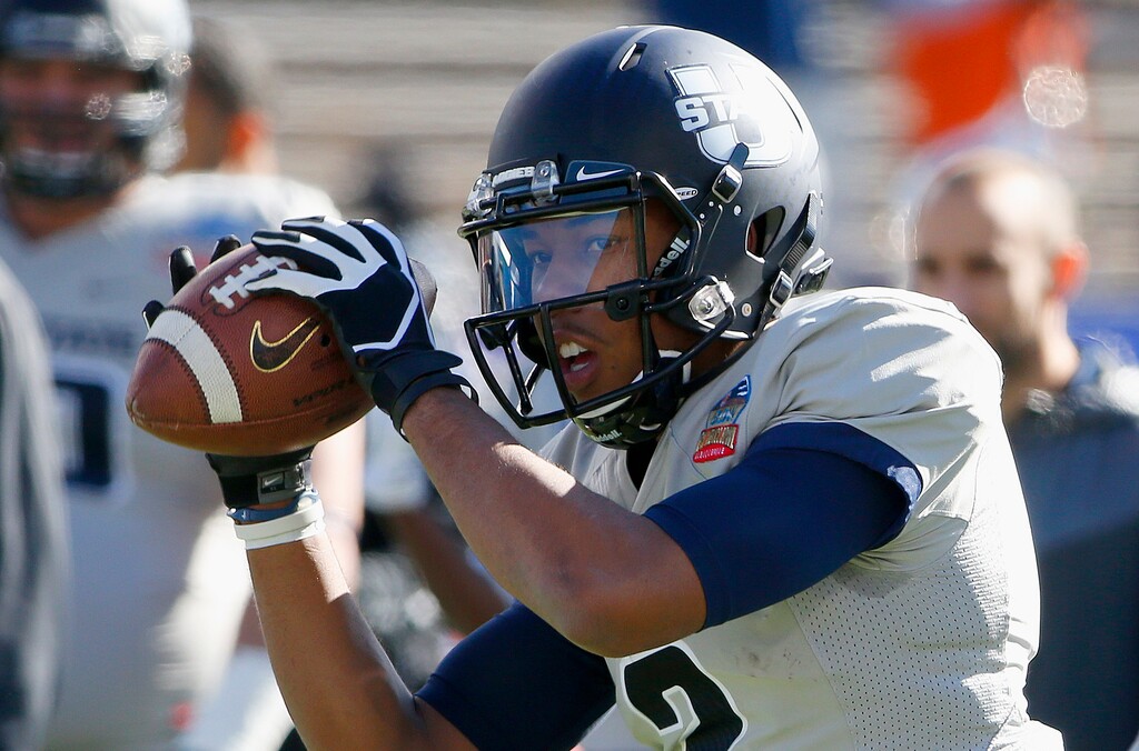 Utah State's Kent Myers warms up prior to a New Mexico Bowl NCAA college football game against UTEP Saturday, Dec. 20, 2014, in Albuquerque, N.M. (AP Photo/Ross D. Franklin) 