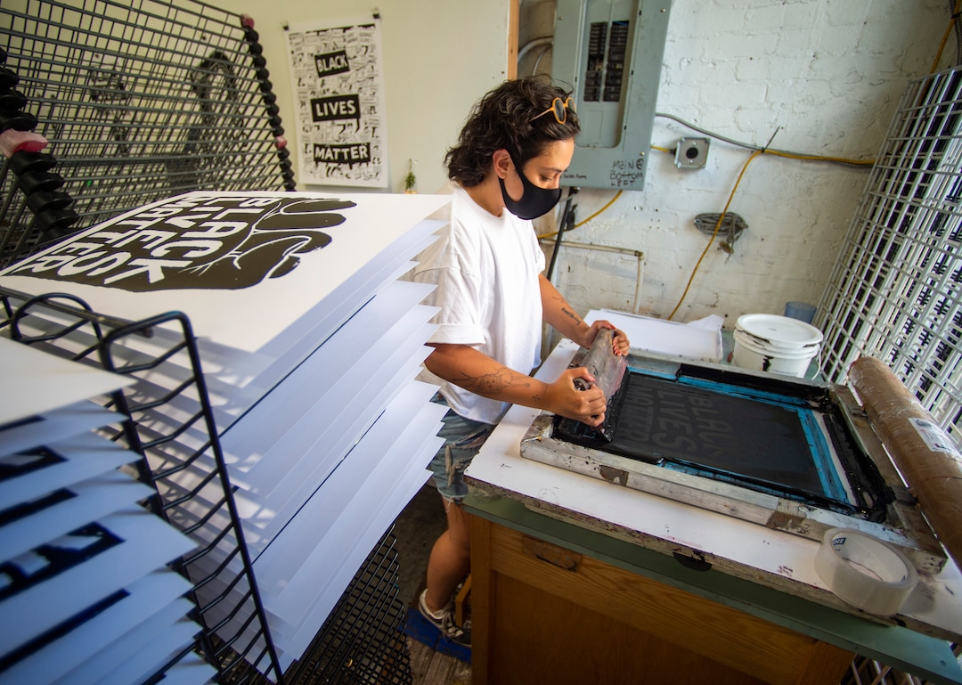 (Rick Egan  |  The Salt Lake Tribune)     Volunteer Taylar Jackson, makes silk screen prints for protest posters, Friday, June 26, 2020.