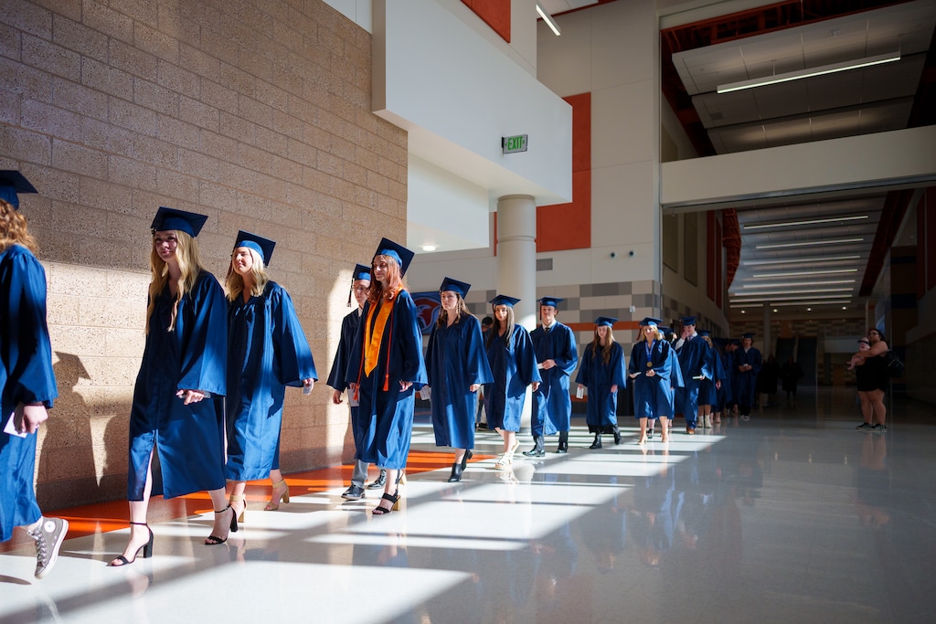(Trent Nelson | The Salt Lake Tribune) Kings Peak High School students walk in the virtual school's first commencement in Bluffdale on June 2, 2022. The new online school is one program that Jordan School District school board members cited in seeking a tax increase, in part to provide choices for students.