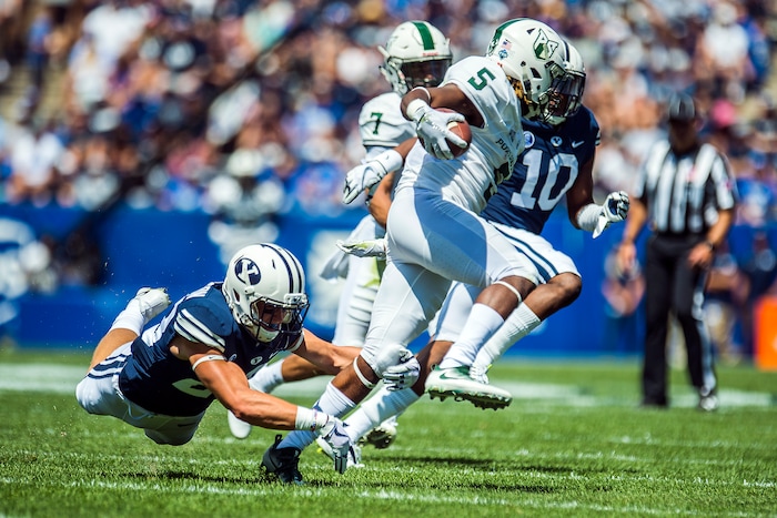(Chris Detrick  |  The Salt Lake Tribune)  Brigham Young Cougars Zayne Anderson (23) tackles Portland State Vikings wide receiver Kahlil Dawson (5) during the game at LaVell Edwards Stadium Saturday, August 26, 2017.
