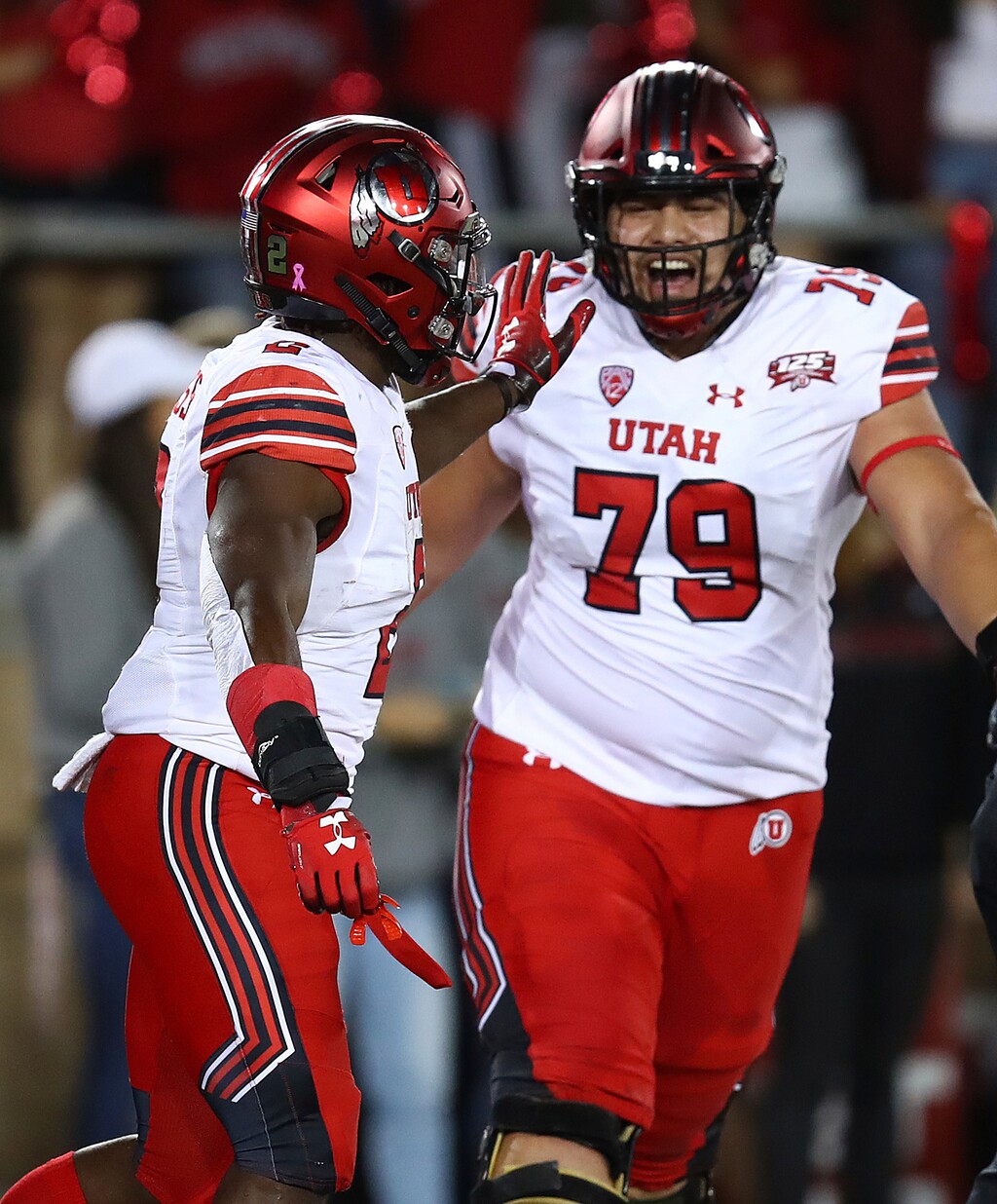 Utah's Zack Moss, left, celebrates with Jordan Agasiva (79) after scoring a touchdown against Stanford during the first half of an NCAA college football game Saturday, Oct. 6, 2018, in Stanford, Calif. (AP Photo/Ben Margot)