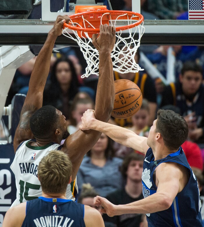 (Rick Egan  |  The Salt Lake Tribune)    Utah Jazz forward Derrick Favors (15) fouled by Dallas Mavericks forward Doug McDermott (20), in NBA action between Utah Jazz and Dallas Mavericks in Salt Lake City, Saturday, Feb. 24, 2018.