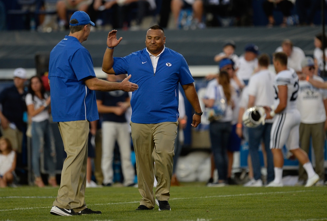 (Francisco Kjolseth  |  The Salt Lake Tribune)  BYU offensive coordinator Jeff Grimes and head coach Kalani Sitake take to the field during takes to the field before their game against California in the NCAA college football game, Saturday, Sept. 8, 2018, at LaVell Edwards stadium in Provo, Utah.