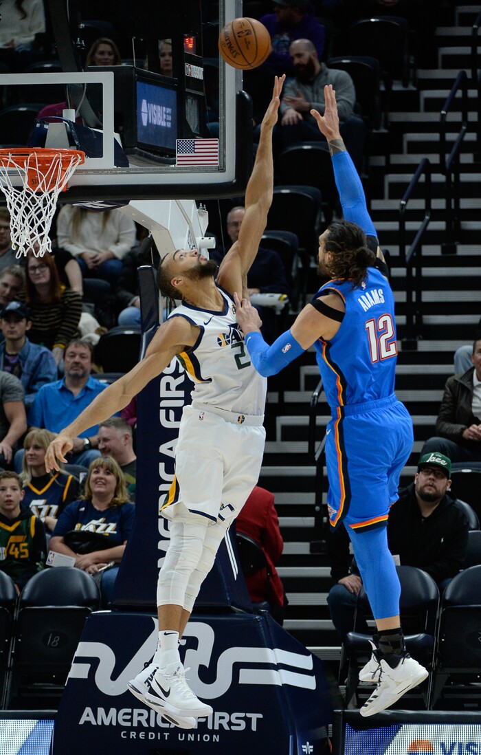 (Francisco Kjolseth  |  The Salt Lake Tribune)  Utah Jazz center Rudy Gobert (27) tries to block Oklahoma City Thunder center Steven Adams (12) as the Utah Jazz host the Oklahoma City Thunder in their NBA basketball game at Vivint Smart Home Arena in Salt Lake City on Mon. Dec. 9, 2019.