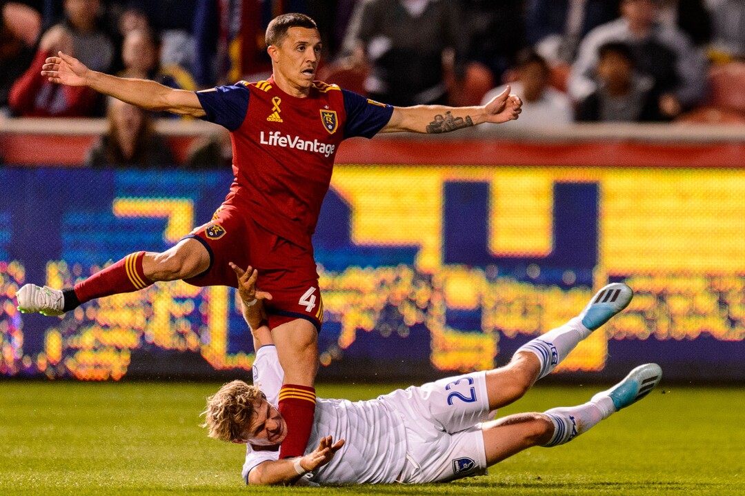 (Trent Nelson  |  The Salt Lake Tribune)  Real Salt Lake defender Donny Toia (4) leaps over San Jose Earthquakes midfielder Florian Jungwirth (23) as Real Salt Lake hosts the San Jose Earthquakes, MLS soccer at Rio Tinto Stadium in Sandy on Wednesday Sept. 11, 2019.