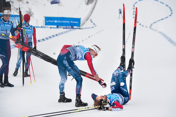 (Scott Sommerdorf   |  The Salt Lake Tribune)   
Ben Berend reaches down to console Taylor Fletcher after the 10K cross country race at the Nordic Combined Olympic Trials. Bryan Fletcher won the Nordic Combined Olympic Trials in Park City, Saturday, December 30, 2017.