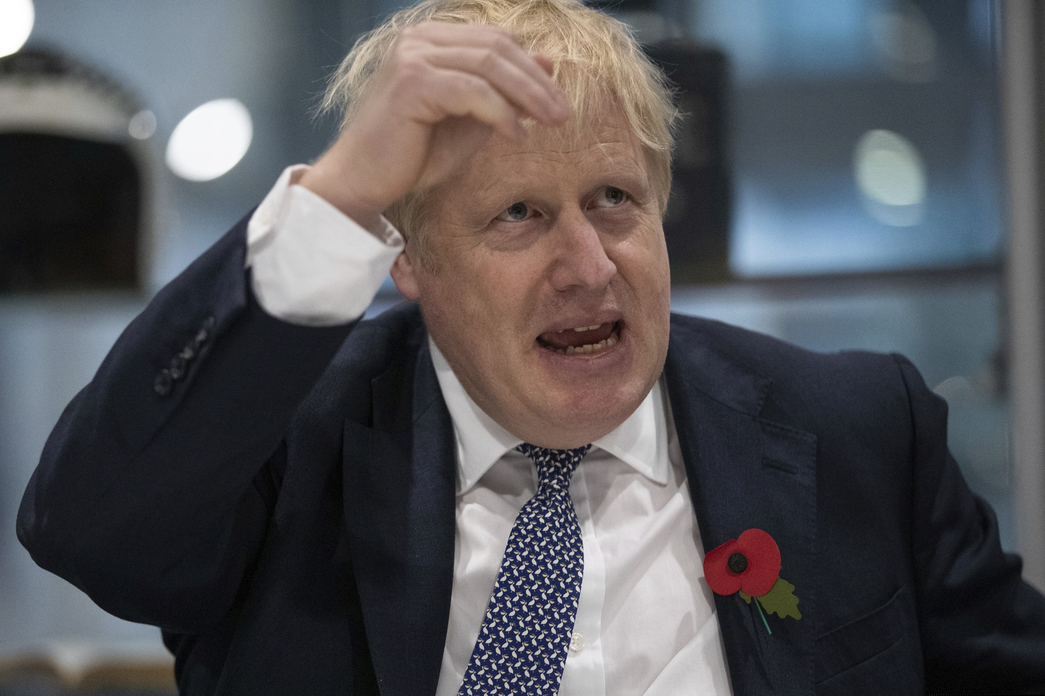 Britain's Prime Minister Boris Johnson gestures, during a visit to Metropolitan Police training college in Hendon, north London, Thursday, Oct.  31,2019. (Aaron Chown/Pool Photo via AP)