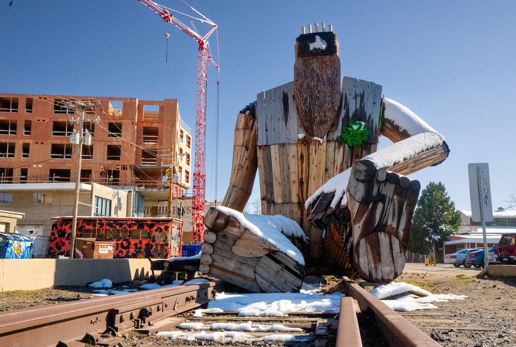 (Francisco Kjolseth | The Salt Lake Tribune) A giant wood troll by local artist Garth Franklin sits on the old railroad tracks at 400 W. 700 South in Salt Lake City, Wednesday, March 19, 2025. The Granary District Alliance has been working with the city to make the area more pedestrian friendly and making efforts to incorporate more art works.