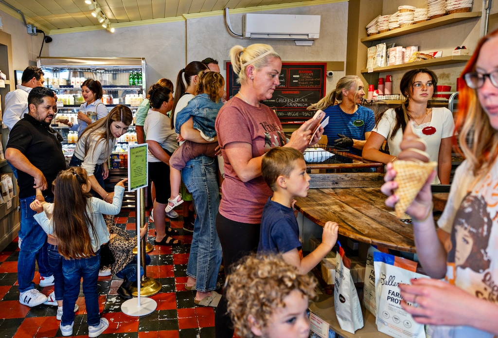 (Kim Raff | The New York Times) Visitors line up to buy goods at the packed Ballerina Farm Store in Midway, Utah, on May 23, 2026. Tourists are flocking to Midway, Utah. The Ballerina Farm Store, from the influencer whose brand revolves around motherhood and farm life, is a reason.