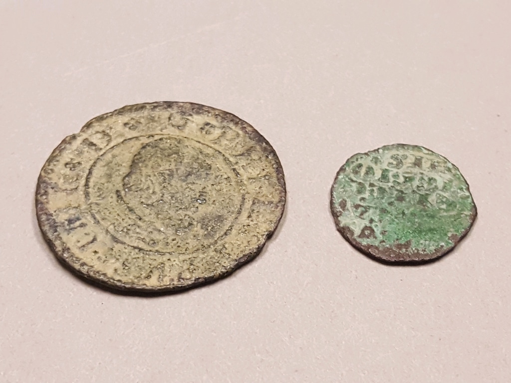 Photo courtesy of the National Park Service
A hiker recently discovered these two Spanish coins, dating to the 13th and 17th centuries, near Halls Crossing in Glen Canyon National Recreation Area.