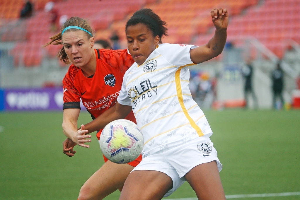 Utah Royals FC defender Elizabeth Ball, right, battles with Houston Dash forward Veronica Latsko for the ball during the first half of an NWSL Challenge Cup soccer match at Zions Bank Stadium Tuesday, June 30, 2020, in Herriman, Utah. (AP Photo/Rick Bowmer)