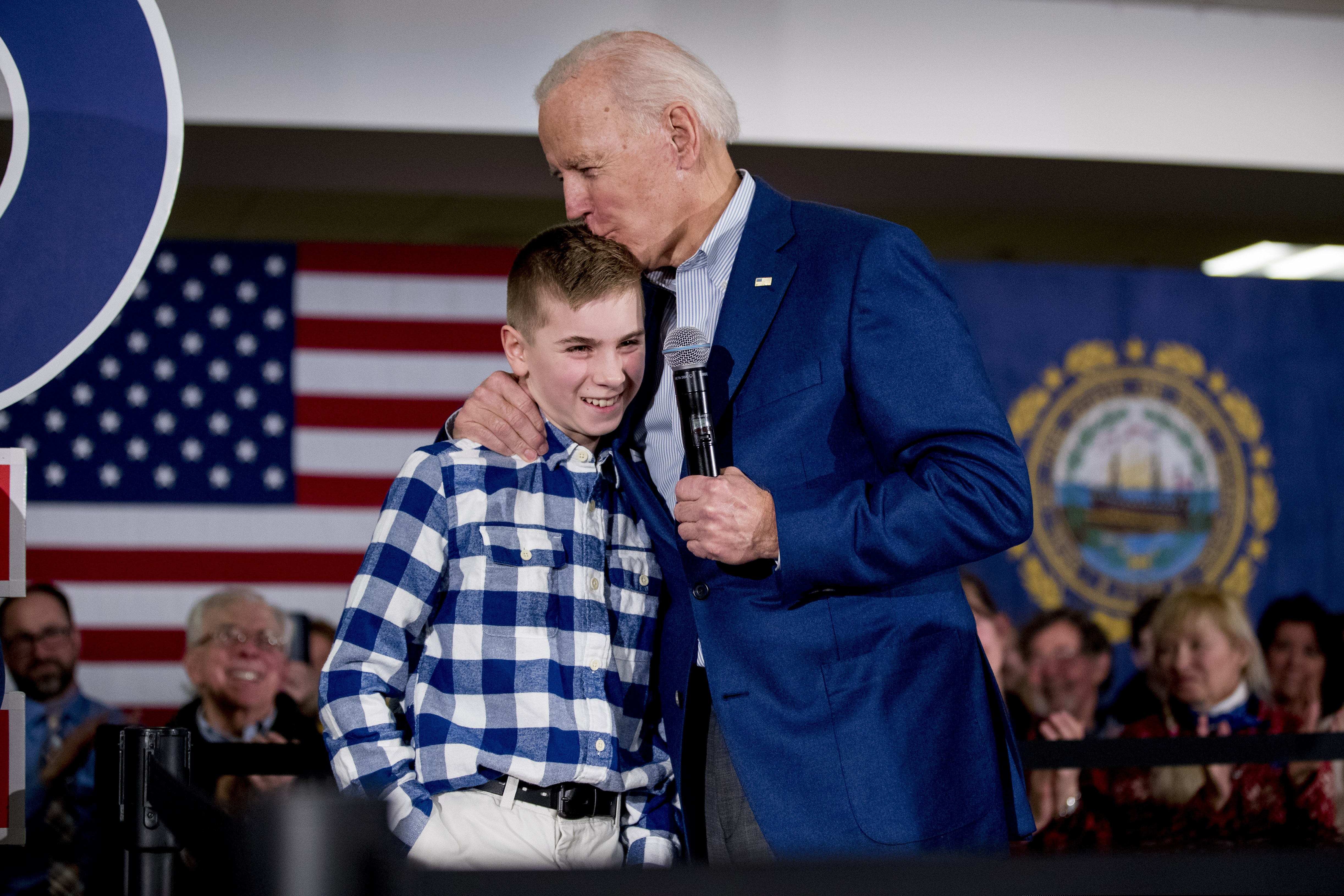 (Andrew Harnik | AP photo)
Democratic presidential candidate former Vice President Joe Biden kisses Brayden Harrington, 12, at a campaign stop at Gilford Community Church, Monday, Feb. 10, 2020, in Gilford, N.H. Biden and Harrington have spoken to each other about their stutter they have both struggled with.
