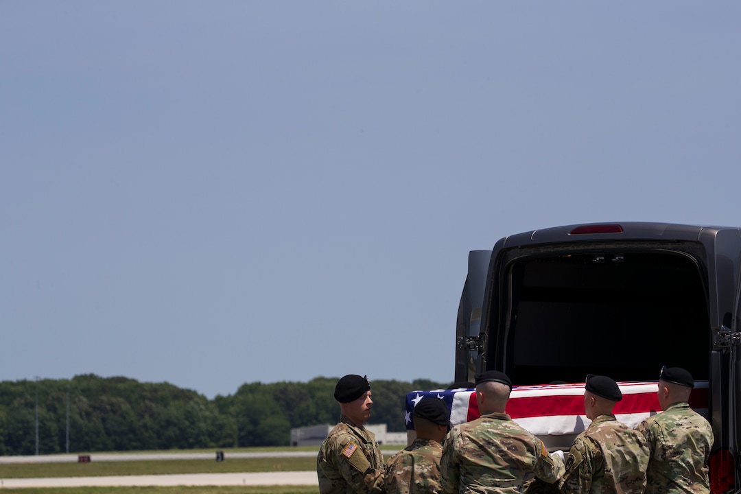 (Alex Brandon  |  AP Photo) An Army carry team moves a transfer case containing the remains of U.S. Army Sgt. 1st Class Elliott J. Robbins, at Dover Air Force Base, Del., Tuesday, July 2, 2019. According to the Department of Defense, Robbins, of Ogden, Utah, assigned to the 10th Special Forces Group died while supporting Operation Freedom's Sentinel.