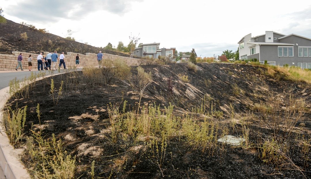 Leah Hogsten  |  The Salt Lake Tribune  Five people were injured and one home was damaged by a fast-moving grass fire on Columbus Court, Tuesday, July 24, 2018. Forty homes were evacuated as flames spread through about 100 acres. Between 50 and 60 firefighters responded to the fire.