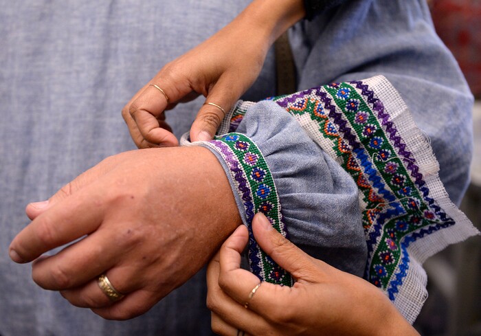 (Al Hartmann  |  The Salt Lake Tribune) 	Scott Tarbet, a member of the chorus in Utah Opera's new production of "Moby-Dick," gets a detail addition to his sleeve by Jessica Jahn, costume designer.