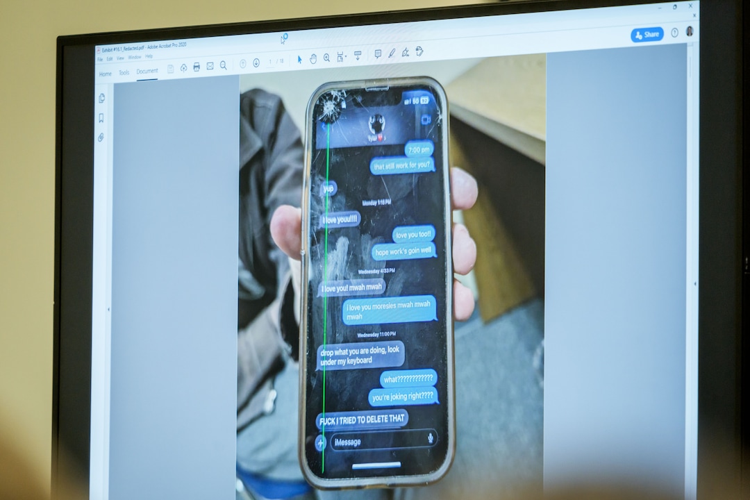 (Spenser Heaps | Pool) A photograph which prosecutors say shows a text message exchange between Tyler Robinson, who is accused in the fatal shooting of Charlie Kirk, and Robinson’s roommate and romantic partner Lance Twiggs, is shown during a preliminary hearing at the Fourth District Courthouse in Provo, Thursday, July 9, 2026.