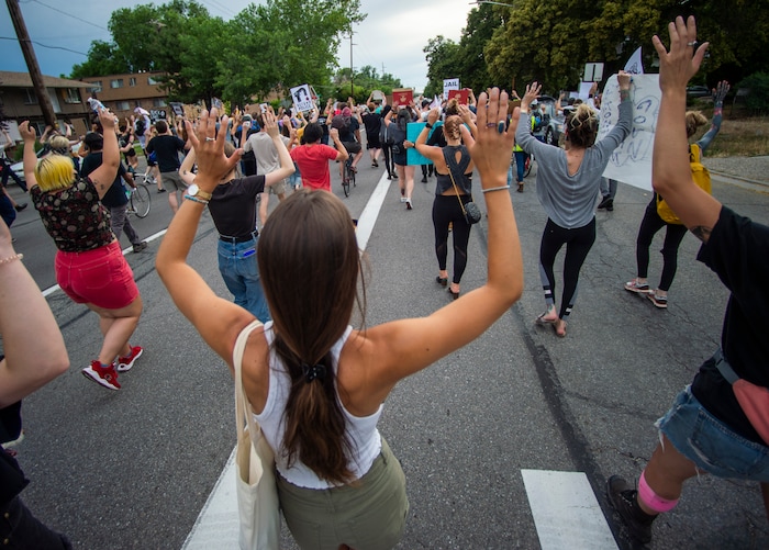 (Rick Egan  |  The Salt Lake Tribune)     Protesters shout "hands up don't shoot" asa they march down the street in Salt Lake City, during a Justice for Bernardo rally on Thursday, June 25, 2020.
