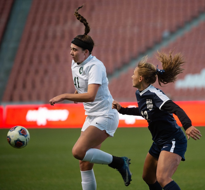 (Francisco Kjolseth  |  The Salt Lake Tribune) Abby Holtby #41 of Olympus battles Sadie Beardall #12 of Bonneville in their 5A high school girls championship game at Rio Tinto Stadium in Sandy on Friday, Oct. 23, 2020. Bonneville went on to win 1-0 in overtime.