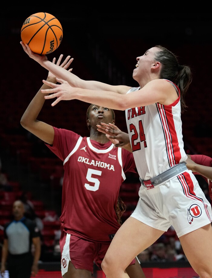 (Francisco Kjolseth | The Salt Lake Tribune) Utah Utes guard Kennady McQueen (24) is pressured by Oklahoma Sooners forward Kiersten Johnson (5) as the University of Utah hosts the Oklahoma Sooners in women’s NCAA basketball in Salt Lake City on Wednesday, Nov. 16, 2022.