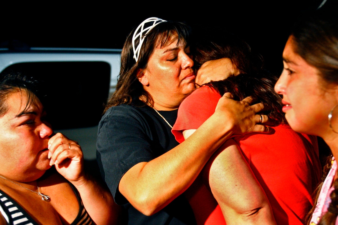 (Chris Detrick  |  The Salt Lake Tribune)  Norma Florez, back left, embraces Maria Lerma, back right, after finding out that Maria's husband, miner Natalio Lerma, was not injured in the Aug. 16, 2007 implosion that killed three rescuers in the Crandall Canyon mine. The situation was still traumatizing for Alejandra Valdez, front left, and Adilene Lerma, front right.