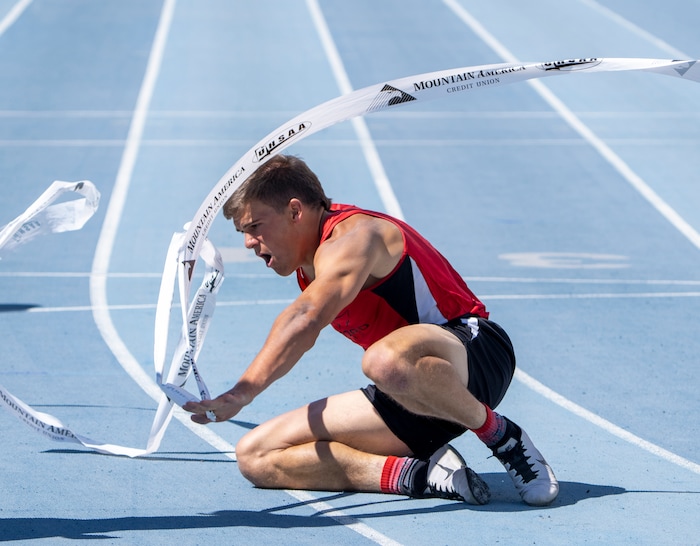 (Rick Egan | The Salt Lake Tribune)  Altamont's Ethan Hansen finishes in second place as Blake Barnes dives headfirst into the finish line for a first place finish in the 1A Boys 200 meter dash, at the State High School Championships at BYU, on Saturday, May 21, 2022.
