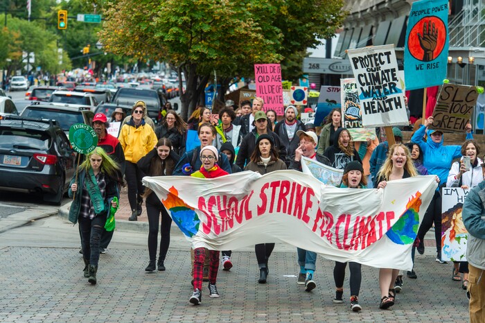 (Rick Egan  |  The Salt Lake Tribune)      Hundreds of students from around the state chant and sing as they march up State Street to the Utah State Capitol Building, demanding action on the climate crisis. Friday, Sept. 20, 2019.