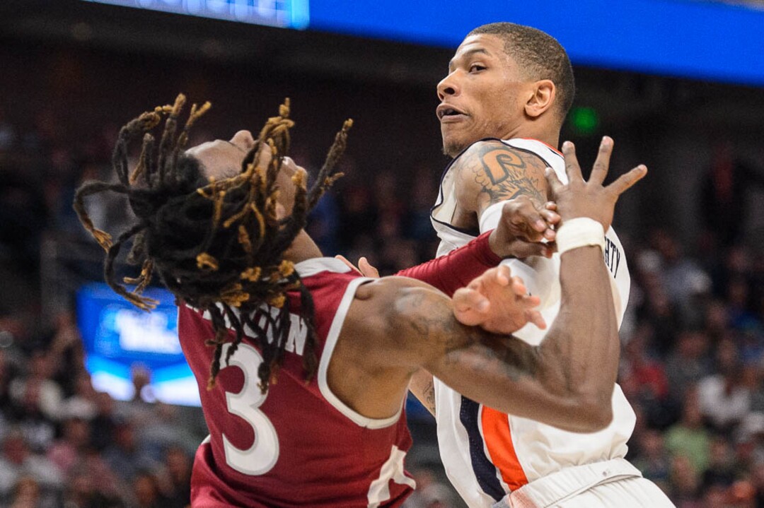 (Trent Nelson | The Salt Lake Tribune)  Auburn Tigers guard Samir Doughty (10) fouls New Mexico State Aggies guard Terrell Brown (3) as Auburn faces New Mexico State in the 2019 NCAA Tournament in Salt Lake City on Thursday March 21, 2019.