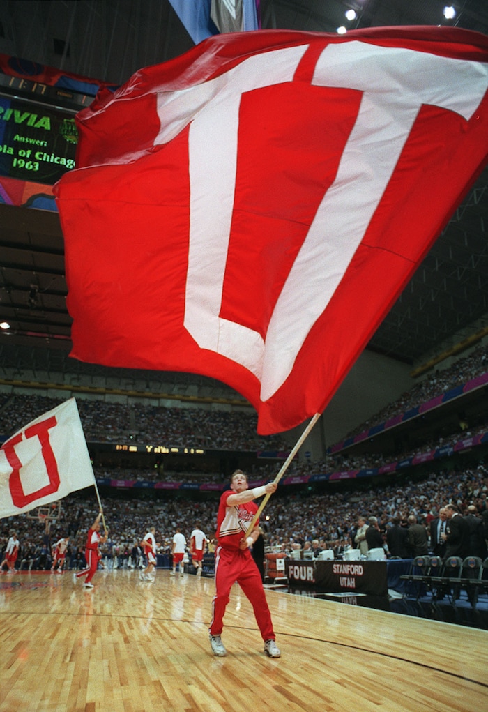 (Steve Griffin  |  Tribue file photo)  The University of Utah cheerleaders whip fans into a frenzy prior to the tip of the Utes final game against Kentucky in 1998 at the Alamodome in San Antonio, Texas.