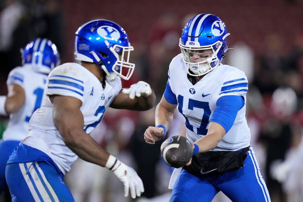 BYU quarterback Jacob Conover (17) hands the ball off to running back Christopher Brooks during the second half of an NCAA college football game against Stanford in Stanford, Calif., Saturday, Nov. 26, 2022. (AP Photo/Godofredo A. Vásquez)